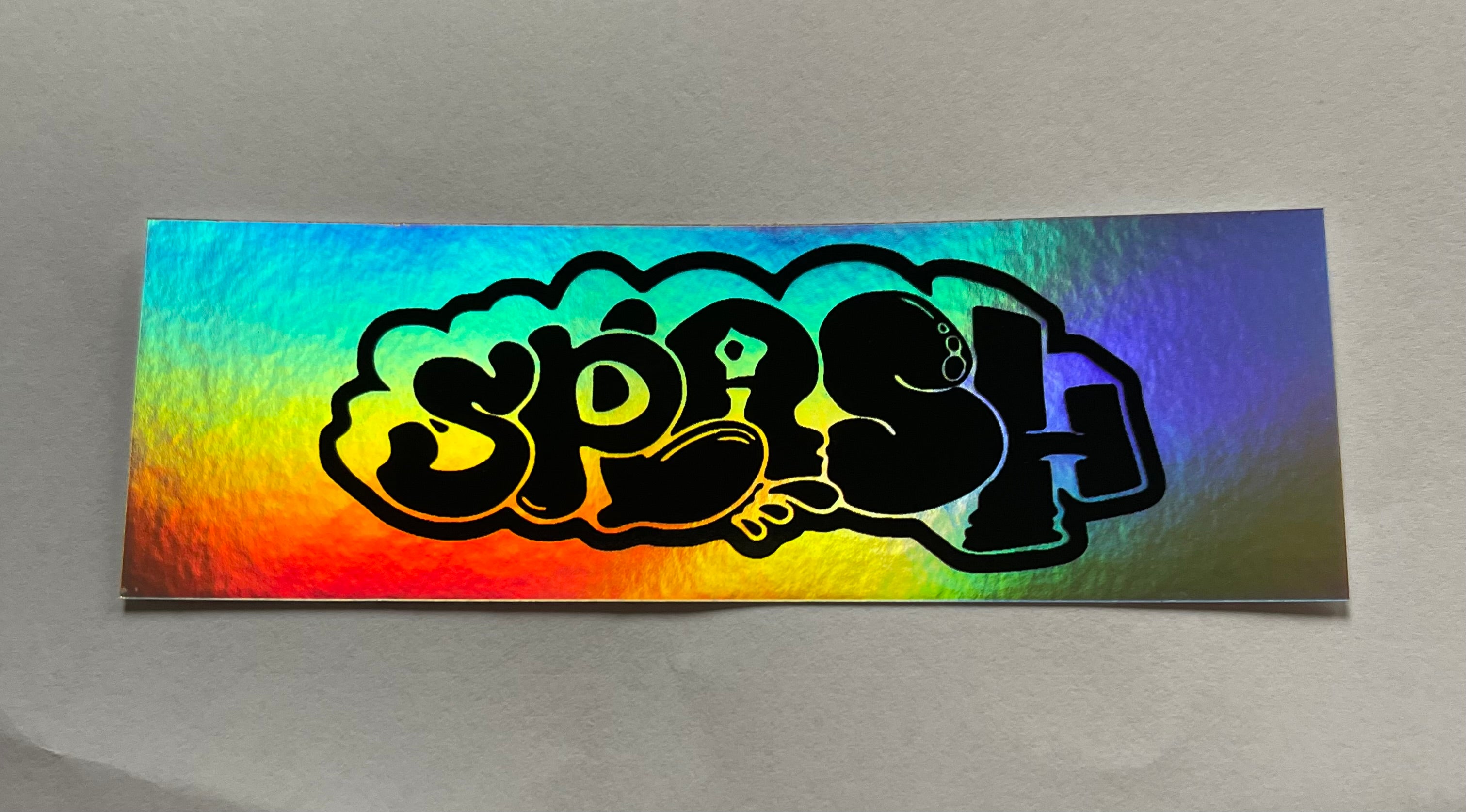 Graffiti Splash Tag Black ink on Mixed vinyl: half Silver Foil half Holographic
4.25 x 1.38" Rectangle Sticker