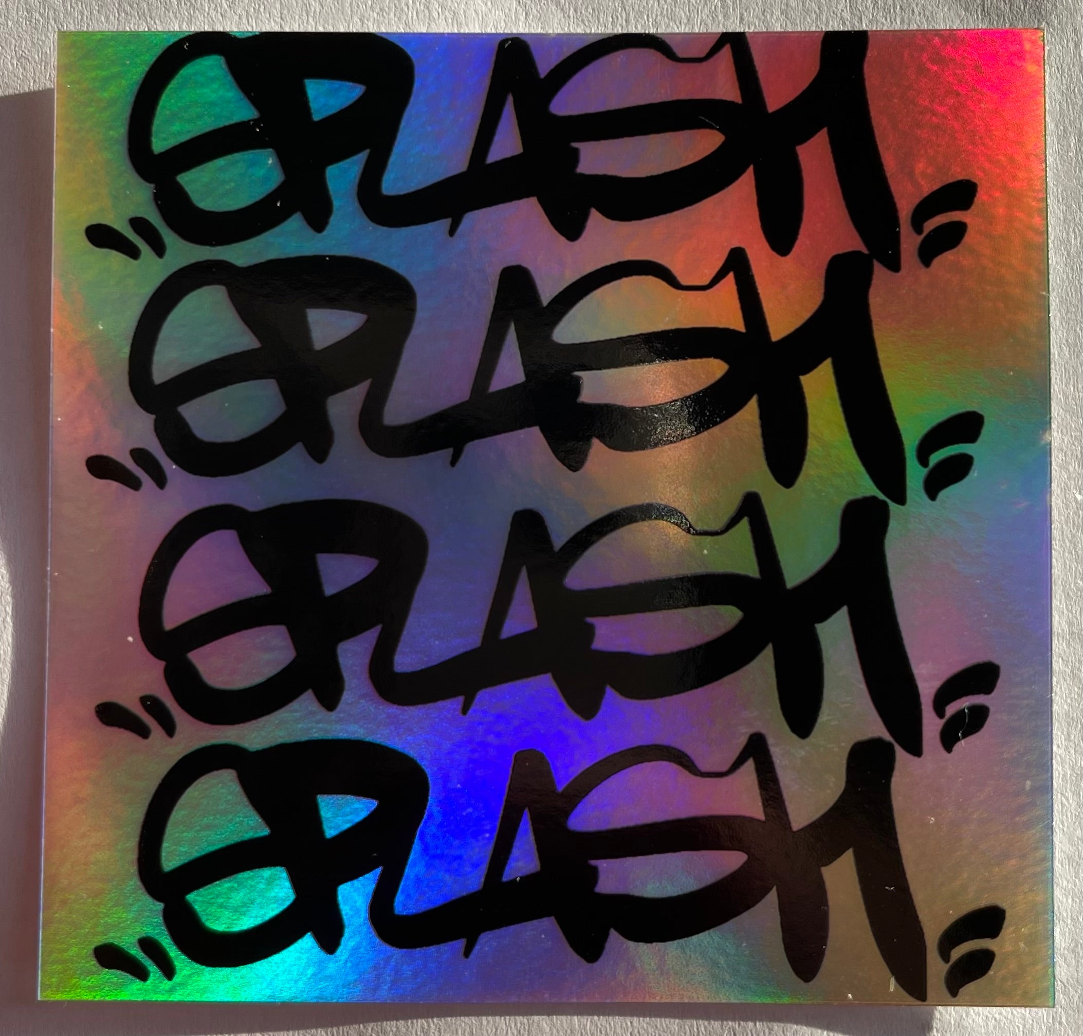 Graffiti Splash Tag Black ink on Mixed vinyl: Half Silver Foil Half Holographic
2.75 x 2.75" Square Sticker